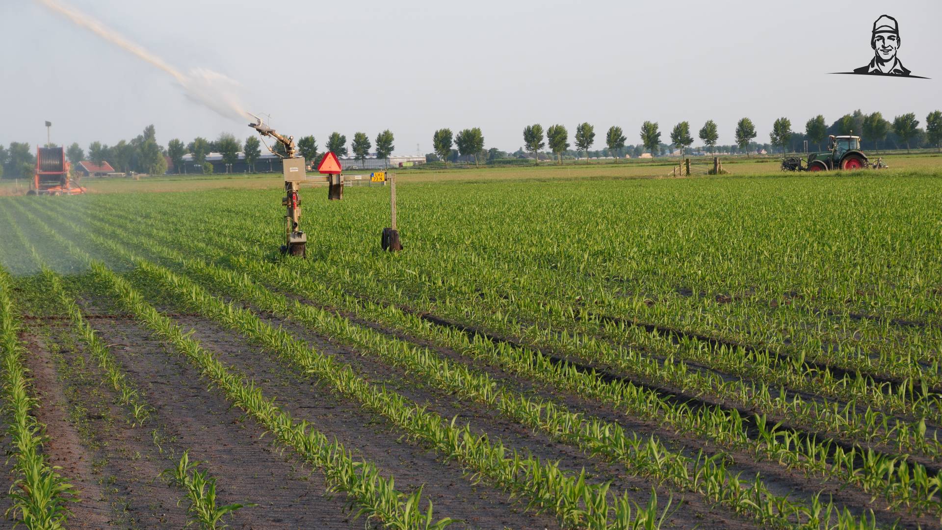 Maisland beregenen met haspel van Grasbaal