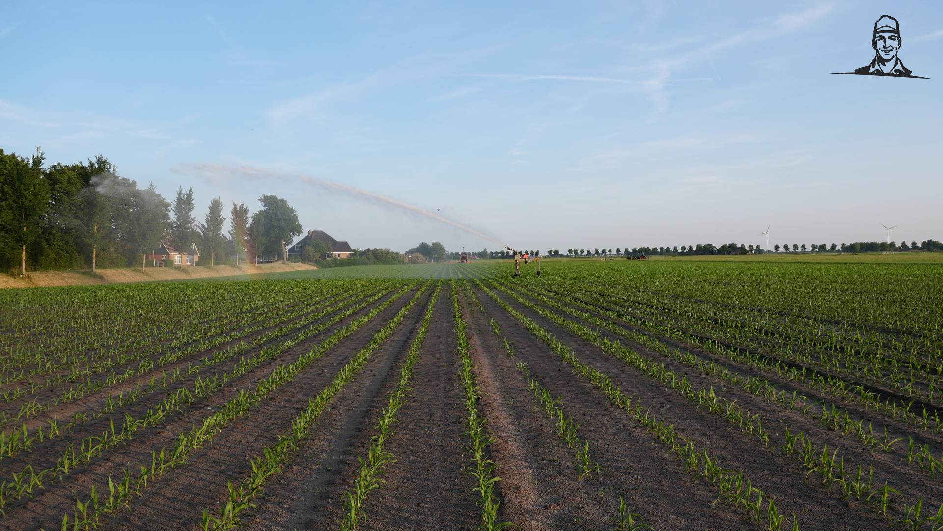 Maisland beregenen met haspel van Grasbaal